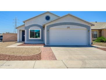 Charming single-Gathering home featuring a two-car garage, low maintenance front yard and neutral color palette at 11501 W Charter Oak Rd, El Mirage, AZ 85335