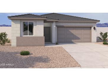 Charming single-story home featuring a two-car garage and low maintenance desert landscaping at 18271 W La Senda Dr, Surprise, AZ 85387