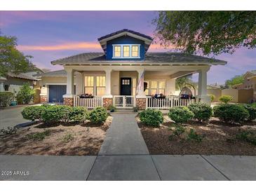 Charming single-Gathering home featuring a welcoming front porch, landscaped yard, and an inviting entrance at 20627 W Grandview Dr, Buckeye, AZ 85396