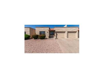 Charming single-story home with a two-car garage and low-maintenance desert landscaping for easy care at 4501 E Carol Ave # 68, Mesa, AZ 85206