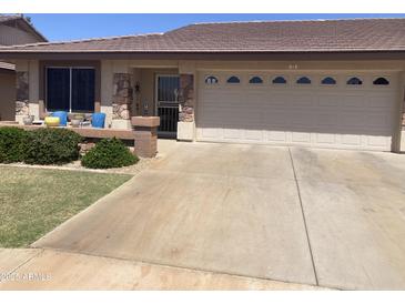 Charming single-story home featuring stone accents, a two-car garage, and well-maintained landscaping at 11360 E Keats Ave # 75, Mesa, AZ 85209