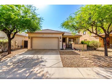 Charming single-story home featuring a two-car garage and desert landscaping at 152 N 194Th Ln, Buckeye, AZ 85326