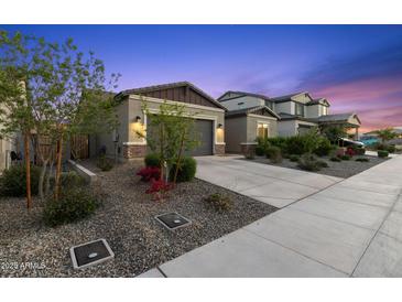 Charming single-story home with a desert-landscaped front yard and a two-car garage at 19231 W Missouri Ave, Litchfield Park, AZ 85340