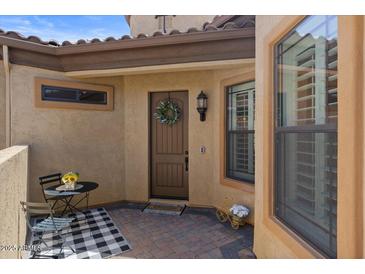 Inviting covered front entry with decorative wreath on the front door at 2145 N 88Th St, Mesa, AZ 85207
