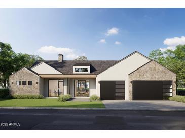 Contemporary home featuring a stone accents, dark garage doors, and a well-manicured lawn at 3743 E Hazelwood St, Phoenix, AZ 85018
