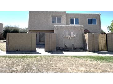 View of the exterior showcasing the building's architecture and outdoor space at 600 S Dobson Rd # 148, Mesa, AZ 85202