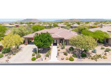 Beautiful single-story home featuring desert landscaping, mountain views and a tile roof at 7500 E Pontebella Dr, Scottsdale, AZ 85266