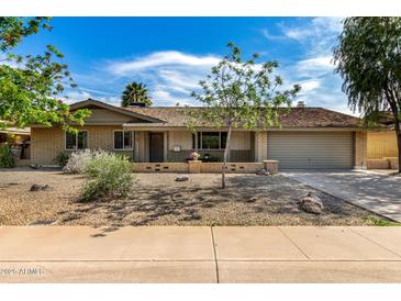 Attractive ranch-style home with a well-kept front yard and inviting curb appeal at 425 E Del Rio Dr, Tempe, AZ 85282
