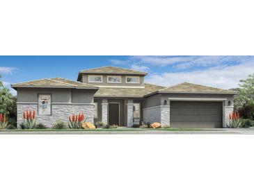 Stylish single-Gathering home featuring stone accents, neutral colors, and a well-manicured front yard at 17560 W Crawfordsville Dr, Surprise, AZ 85388