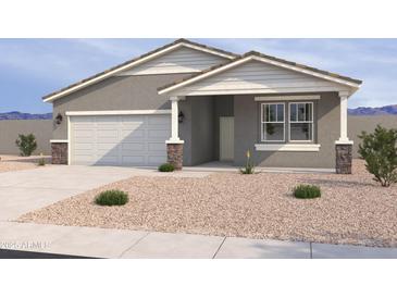 Charming single-story home featuring a two-car garage, desert landscaping, and neutral stucco exterior at 18272 W Camino De Oro --, Surprise, AZ 85387