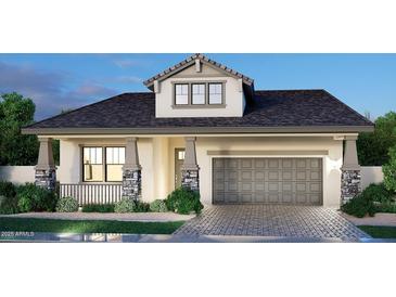 Charming single-Gathering home boasts a two-car garage, stone accents, and beautifully landscaped front yard at 2517 E Presidio St, Mesa, AZ 85213
