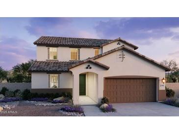 Charming two-story home with a two car garage and nicely landscaped front yard at 25348 W Bowker St, Buckeye, AZ 85326