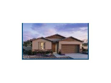 Charming single-story home featuring stone accents, a two-car garage, and a welcoming front entrance at 25354 W Bowker St, Buckeye, AZ 85326