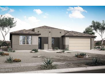 Charming single-story home with desert landscaping and a neutral color palette, complemented by a two-car attached garage at 28922 N 174Th Ln, Surprise, AZ 85387