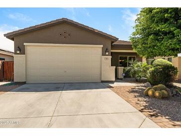 Charming single-story home with a well-manicured front yard and a spacious two-car garage at 799 W Press Rd, San Tan Valley, AZ 85140