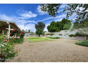 Backyard featuring gravel landscaping, garden and plantings at 4522 E Andora Dr, Phoenix, AZ 85032