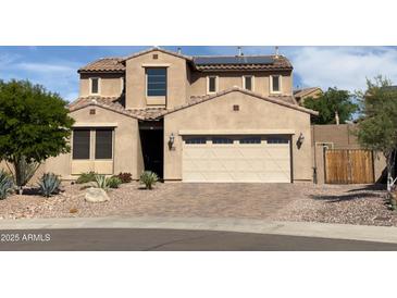 Beautiful two-story home featuring a well-maintained front yard and a spacious two car garage at 12950 W Cassia Trl, Peoria, AZ 85383