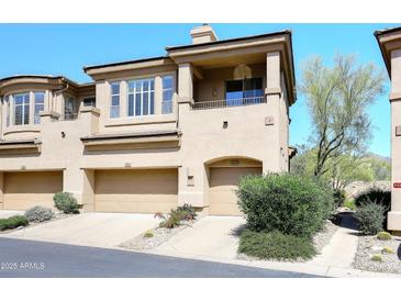 Inviting townhouse with a private garage and desert landscaping at 16420 N Thompson Peak Pkwy # 2020, Scottsdale, AZ 85260
