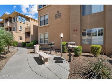 Landscaped exterior with grills and comfortable seating at this apartment complex at 20100 N 78Th Pl # 3084, Scottsdale, AZ 85255