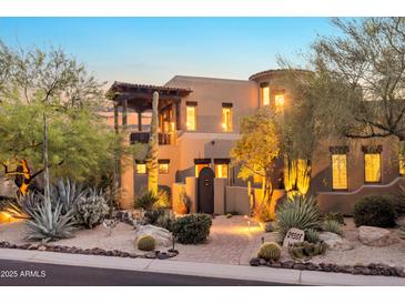 Stunning two-story home showcasing desert landscaping and architectural design at twilight at 29308 N 108Th N Pl, Scottsdale, AZ 85262