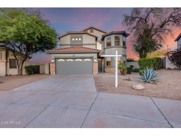 Charming two-story home with a well-manicured yard and a two-car garage is perfect for any Gathering at 18103 W Canyon Ln, Goodyear, AZ 85338