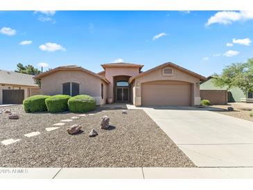 Charming single-story home featuring a well-manicured front yard and inviting entrance at 2453 E Nathan Way, Chandler, AZ 85225
