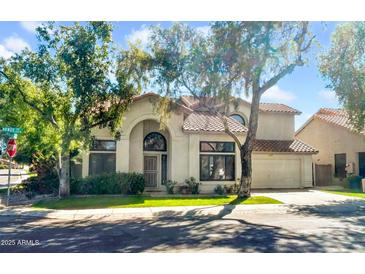 Charming two-story home with tile roof, well-manicured lawn, and mature shade trees at 155 W Knox Rd, Tempe, AZ 85284