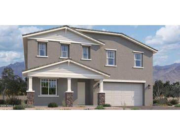 Charming two-story home showcasing a stone-accented porch and a neutral color palette at 5531 W Hopi Trl, Laveen, AZ 85339