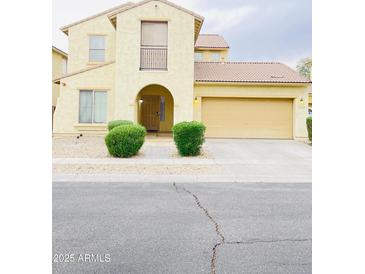 Charming two-story home with a two car garage and well-manicured front yard at 7136 N 73Rd Dr, Glendale, AZ 85303