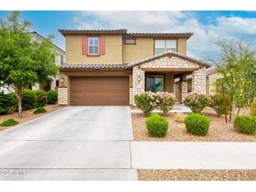 Charming two-story home with a well-manicured front yard and a two-car garage, perfect for suburban living at 17424 W Willow Ave, Surprise, AZ 85388