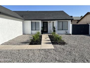 Charming single-story home featuring a well-maintained lawn and modern design at 6217 W Comet Ave, Glendale, AZ 85302