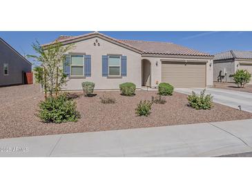 Attractive single-story home featuring desert landscaping and blue shutters at 2775 N Mulberry Pl, Casa Grande, AZ 85122