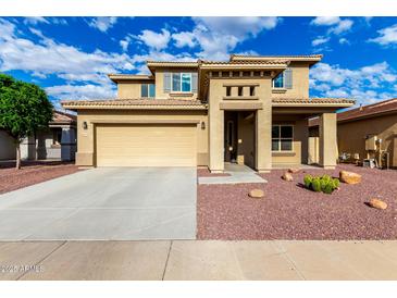 Charming two-story stucco home featuring a two-car garage and drought tolerant landscaping at 16333 N 181St Ave, Surprise, AZ 85388