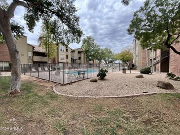 Relaxing community pool area with lounge chairs and outdoor seating, perfect for enjoying the Arizona sunshine at 200 E Southern Ave # 133, Tempe, AZ 85282