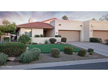 Charming single-story home boasts mature landscaping and a neutral color palette at 2635 N 62Nd St, Mesa, AZ 85215