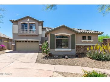 Charming two-story home with a balcony and low-maintenance desert landscaping at 3025 W Sentinel Rock Rd, Phoenix, AZ 85086