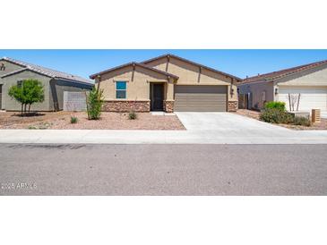 Charming single-story home featuring a two-car garage and low-maintenance desert landscaping at 12474 W Glenn Ct, Glendale, AZ 85307