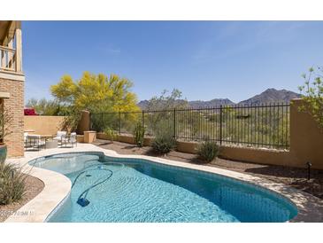 Inviting pool featuring desert landscaping and mountain views at 18267 N 95Th St, Scottsdale, AZ 85255