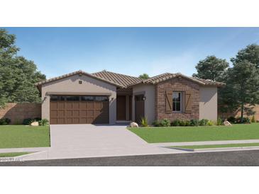 Charming single-story home with a two-car garage, stone accents and a well-manicured lawn at 16842 W Bronco Trl, Surprise, AZ 85387