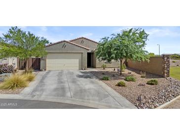Charming single-story home with a two-car garage, desert landscaping, and a well-maintained front yard at 37103 N El Morro Trl, San Tan Valley, AZ 85140