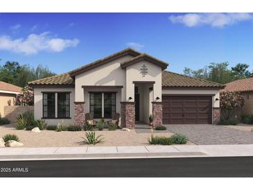 Beautiful single-story home featuring stone accents, a covered entry, and a two-car garage at 42046 N Golden Trl, San Tan Valley, AZ 85140
