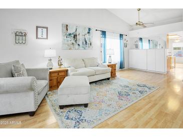 Bright living room with a vaulted ceiling, neutral furniture and a colorful area rug at 542 S Higley Rd # 52, Mesa, AZ 85206