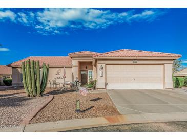 Charming single-story home with a well-maintained yard and a two-car garage at 6331 S Cypress Point Dr, Chandler, AZ 85249