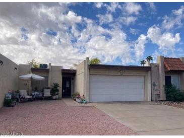 Charming single-story home with a private courtyard and attached two-car garage at 849 W Duke Dr, Tempe, AZ 85283