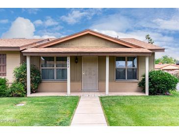Charming single-story home featuring a covered entryway and well-maintained landscaping at 2502 N 22Nd Dr, Phoenix, AZ 85009