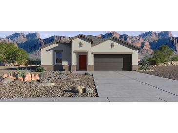 Charming single-story home featuring desert landscaping and a two-car garage with mountain views at 5751 E Axle Ln, San Tan Valley, AZ 85140
