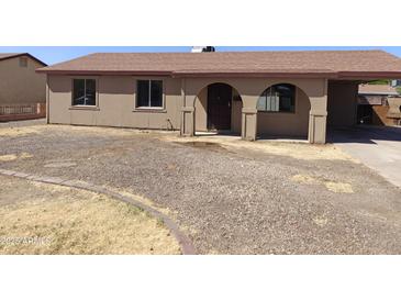 Charming single-story home with a covered porch and a low maintenance front yard at 6226 W Coronado Rd, Phoenix, AZ 85035