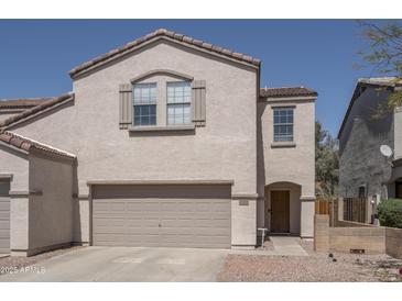 Charming two-story home with a two-car garage and desert landscaping at 7028 W Lincoln St, Peoria, AZ 85345