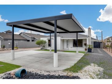 Attractive home with a stylish carport, artificial turf landscaping and desert accents at 2236 N 22Nd St, Phoenix, AZ 85006