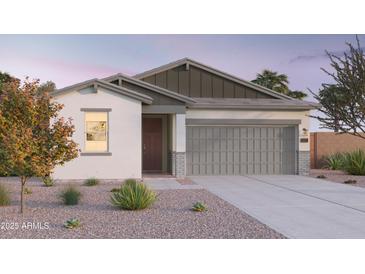 Charming single-story home with a two-car garage and neutral color palette at 12580 W Trumbull Rd, Avondale, AZ 85323